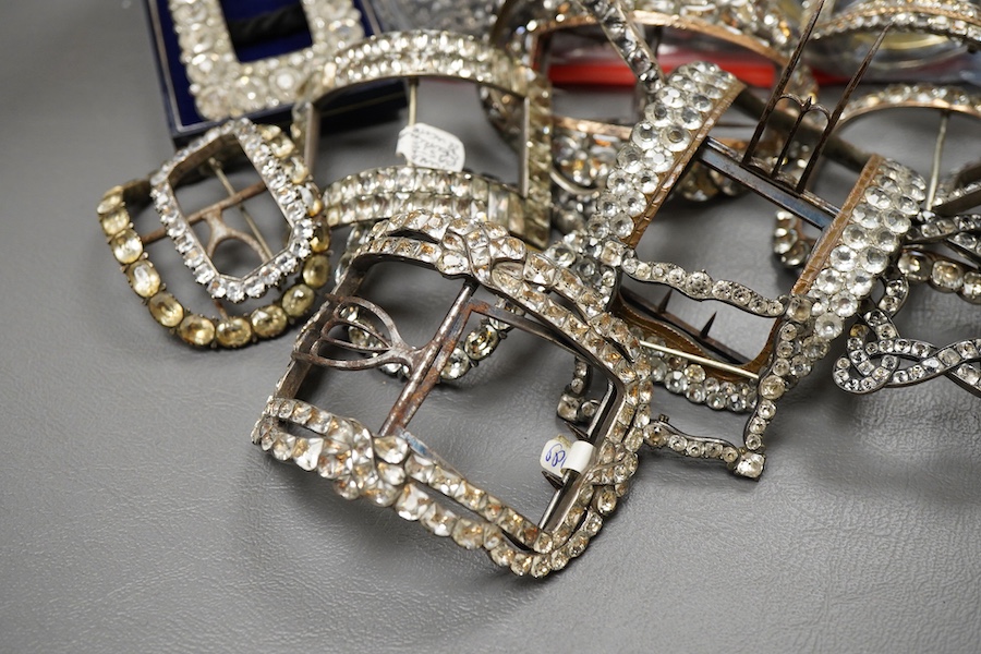 A large collection of buckles, 18th-19th century, of oval and rectangular outline, set with pastes or cut steel, mostly mounted in steel, a minority in silver, some with later brooch fittings